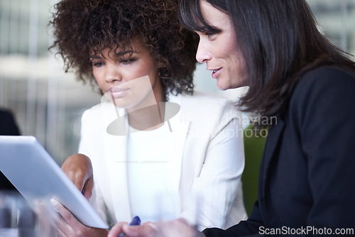 Image of Team, tablet and business women in discussion, planning and brainstorming meeting in office. Collaboration, tech and diverse professional people or consultants in conversation together for project