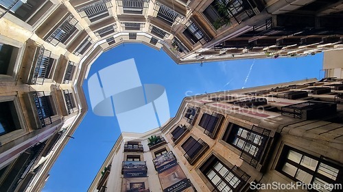 Image of BARCELONA, SPAIN - APRILL 2, 2024: Looking up at the architecture of a building