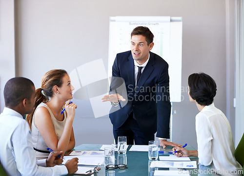Image of Meeting, presentation and businessman in office with discussion, stats or speaker at b2b workshop. Teamwork, management and business people in conference room brainstorming ideas, planning and review