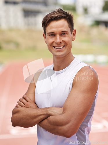 Image of Athlete, portrait and happy for fitness on stadium, commitment and wellness of sprinting professional. American, man and face with smile for confident in sport, outdoor and training for health body