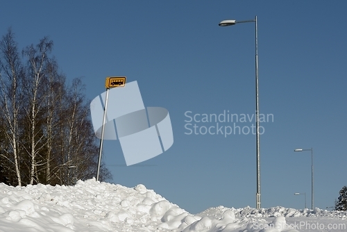 Image of bus stop outside the city in winter on a cloudy day in Finland