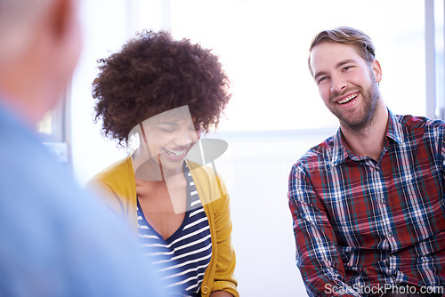 Image of Funny, team and business people in meeting, discussion or story in creative startup office for collaboration. Happy group, diverse designers and laugh at conversation, joke or staff talking together