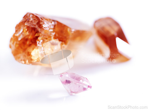 Image of Gemstone, citrine and pink diamond in studio with isolated white background for natural resource, jewel and sparkle for luxury. Rock, crystal and reflection in closeup for shine, glow and mineral