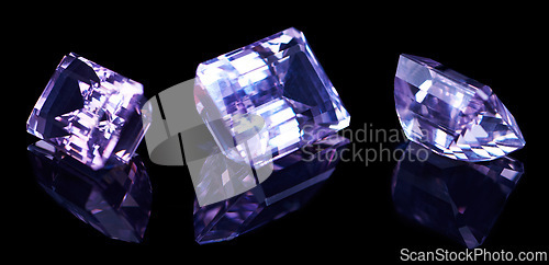 Image of Purple, gemstone and rock on black background for luxury, expensive and glass textures in studio. Violet, diamond or crystal with treasure, shine and ring production in reflection for gift or present