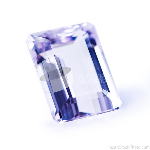 Image of Violet, gemstone or jewelry on a white background for luxury, expensive and rich design in studio. Purple, diamond or crystal rock for texture, glamor and ring with shine and reflection for gift