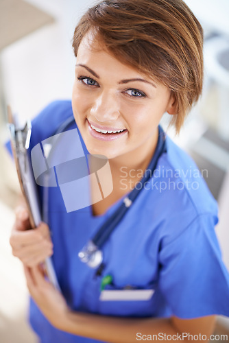 Image of Woman, nurse and smile portrait with clipboard in medical office, nutritionist and stethoscope, professional nursing career. Results, healthcare and medic for wellness in uniform for surgery