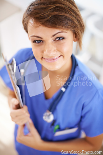 Image of Woman, nurse and happy portrait with clipboard in medical office, nutritionist and stethoscope, professional nursing career. Results, healthcare and medic for wellness in uniform for surgery