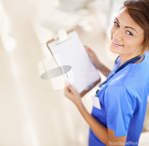 Image of Happy woman, portrait and nurse with clipboard above for life insurance, policy or medical prescription at hospital. Top view of female person or scrub with smile, document or paperwork for checklist