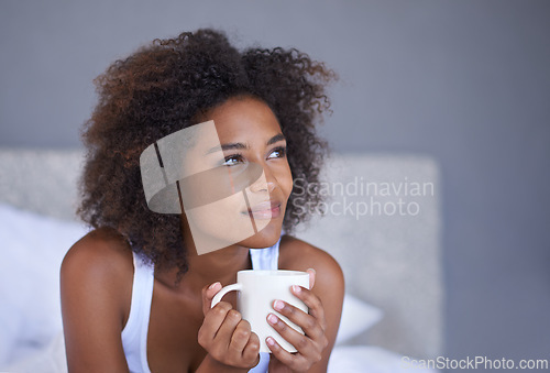 Image of Black woman, face and thinking with coffee in bed for morning, vision or memory in comfort at home. Young African female person with afro in wonder or thought with beverage or drink in the bedroom