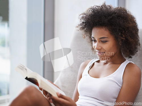 Image of Woman, rest and reading a book in bedroom, calm and adventure in action novel on break in morning. Lady, learning and inspiration in self help manual, creativity and relax in soft cushion on vacation