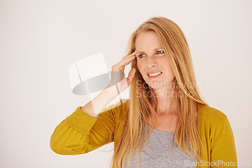 Image of Woman, stress and headache in studio, pain and depression or mental health on white background. Female person, migraine and frustrated with mistake or crisis, burnout and anxiety on mockup space