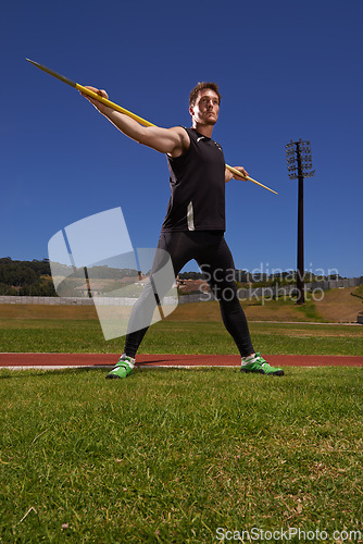 Image of Man, athlete and javelin or sport exercise for competition on grass for workout fitness or outdoor, strength or training. Male person, challenge and target in arena for performance, aim or practice