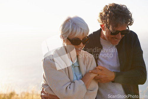 Image of Smile, field and elderly couple in nature for travel, sunset walk or retirement holiday together. Coast, hill and senior people with happiness for tourism, summer vacation and bonding in California