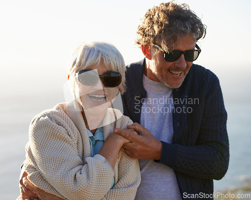 Image of Happy, nature and senior couple with love for travel, tourism and holiday in retirement together. Coast, field and elderly people with smile for summer vacation, bonding and sunset walk in California