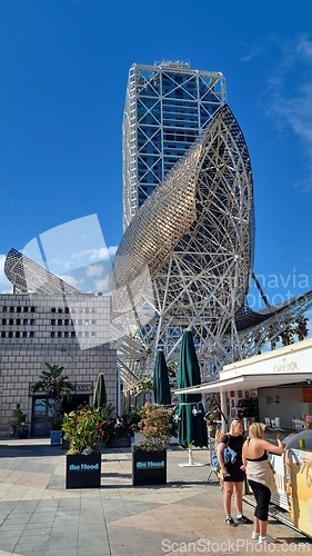 Image of BARCELONA, SPAIN - APRILL 2, 2024: Large metal structure on sidewalk