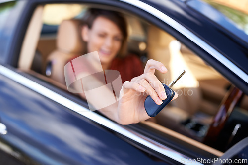 Image of Lets take this for a spin. Closeup shot of a woman sitting in a car holding the keys up to the camera.