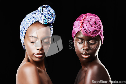 Image of Black women, head wrap and relax portrait with beauty, skincare and natural cosmetics in studio. Traditional, turban and African fashion with wellness and skin glow with makeup and dark background