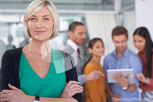 Image of Senior woman, portrait and manager with creative team on technology for networking or research at office. Face of mature female person or CEO in confidence for leadership, group management or startup