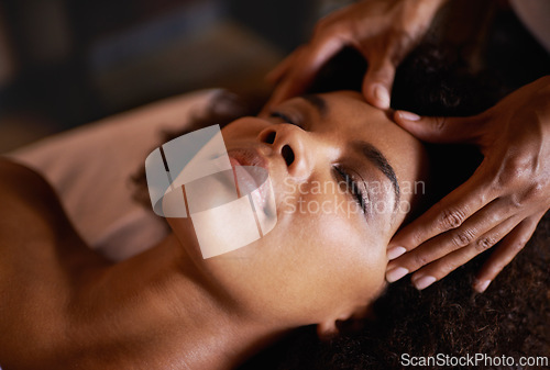 Image of Woman, face and massage with hands and reflexology for facial, spa wellness and beauty treatment on bed. Skin, towel and calm african female person with skincare and relax at hotel with glow