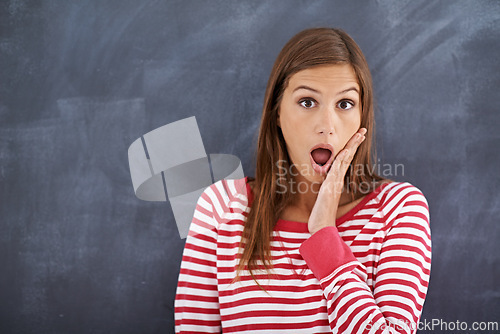 Image of Woman, teacher and shock in portrait by blackboard, wow and what for announcement on curriculum. Female person, surprise and information in classroom, knowledge and mind blown for lesson plan at work