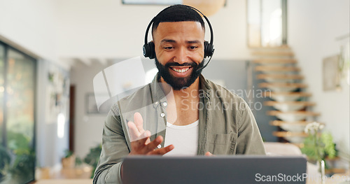 Image of Man, headset and talking in home on video call, live streaming and presentation in online conference. Remote work, laptop or virtual assistant for contact centre or customer support at kitchen table