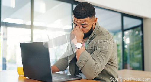 Image of Remote work from home, man and laptop with stress, headache and tired with a deadline or anxiety. Apartment, freelancer or entrepreneur with computer, migraine or burnout with startup debt or fatigue