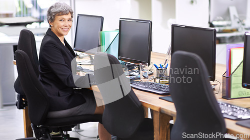Image of Senior, business woman and portrait with computer at agency for communication or networking at office. Mature female person, agent or employee with smile on desktop PC for customer service or support