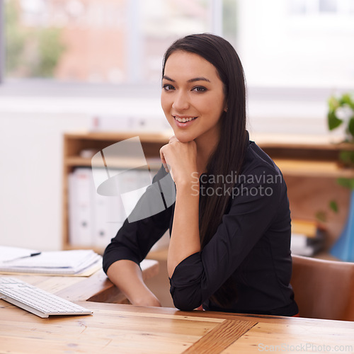 Image of Office, happy and portrait of business Asian woman at desk with confidence, pride and positive attitude. Professional, consultant and portrait of worker for career, job and working in modern building