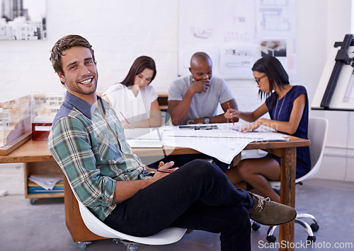 Image of Happy man, creative and portrait with team for meeting, planning or architectural design at office. Employee or architect with smile, documents or paperwork in group project or startup at workplace