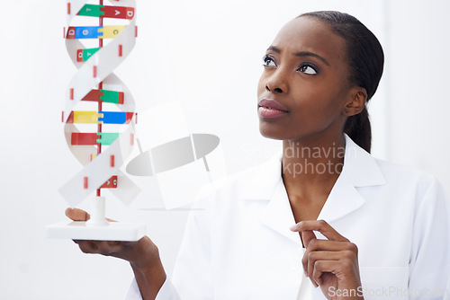 Image of Science, woman and dna model in laboratory with molecule genetics, biological diagnostics and organism development. Scientist, african professional and thinking of helix particles for medical study
