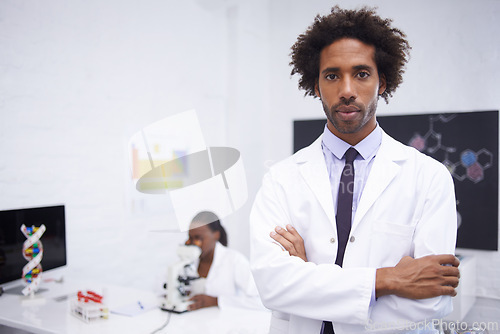 Image of Scientist, portrait and arms crossed with confidence in laboratory for chemical research, medical study and serious. Science, african collaboration and face with pride for pharmaceutical experiment