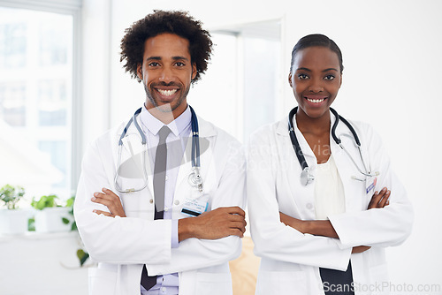 Image of Black people, portrait and doctors with arms crossed for health, confidence in medicine and team at hospital. Cardiovascular surgeon, healthcare and medical professional collaboration with pride