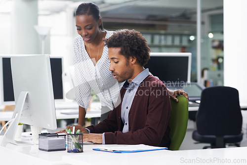 Image of Coworker, computer and desk in office for research, collaboration or career in company for work or profession. Intern or employee with mentor and tech for internet, help or guide for online indoor