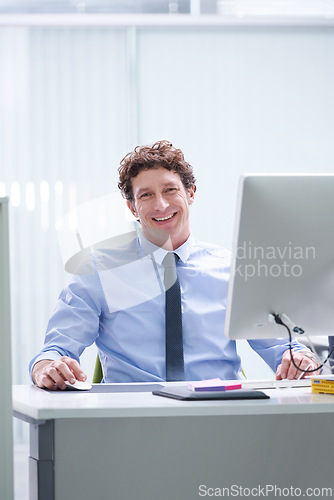 Image of Man, office and portrait with pc and desk, happy and confident corporate male person sitting in workspace. Technology, digital search administrator and smile, browse internet on business computer