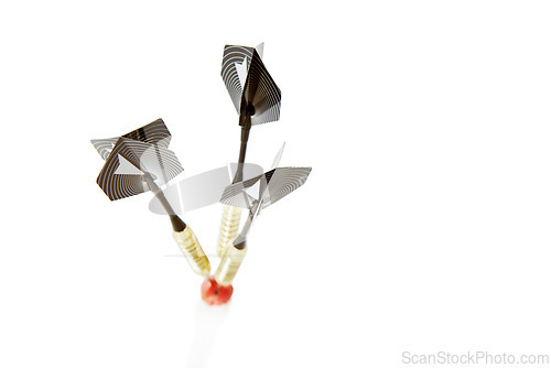 Image of Darts, bullseye and target with marker for mission, goal or accuracy on a white studio background. Closeup of sports equipment, good aim or skill in activity or game of marksmanship on mockup space