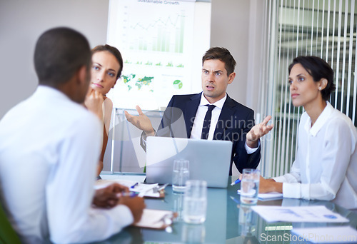 Image of Coworker, office and argue in meeting with laptop for contract, paperwork and discussion for update. Business people, boardroom and client in table with strategy, feedback and company growth.