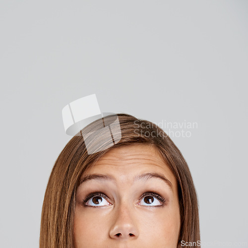 Image of Studio, head and closeup with eyes, thinking and mockup for idea or vision. Woman, planning and memory with optimism, positive and hopeful for future contemplating isolated on white background