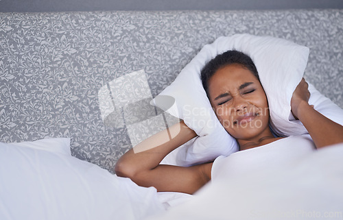 Image of Bed, pillow and woman frustrated by insomnia, anxiety or sleep issue at home. Bedroom, noise and lazy female person in a house angry with morning, fatigue or overthinking sleeping, mistake or fail