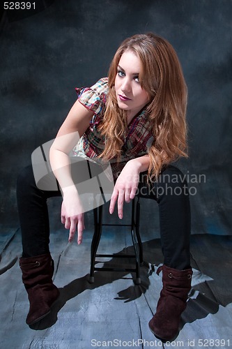 Image of Dirty-blond sitting on stool