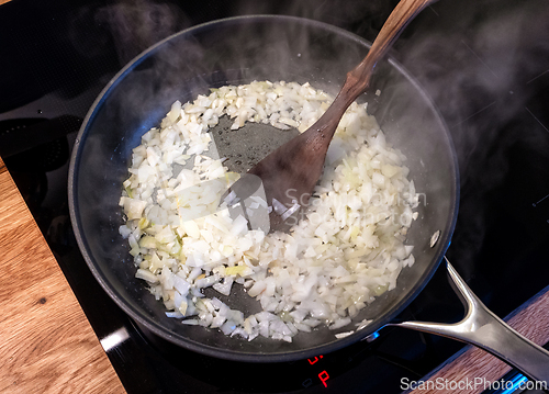 Image of chopped onions in cooking pan