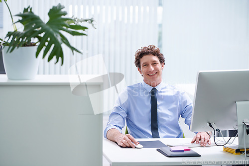 Image of Businessman, office and portrait with corporate technology and desk, happy and confident male person sitting. Workspace, digital search and administrator with smile, browse internet on business pc