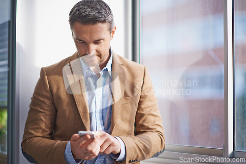 Image of Office, window and man checking phone for networking, email or scroll on social media. Communication, tech startup and businessman on smartphone for consulting, business connection or online chat