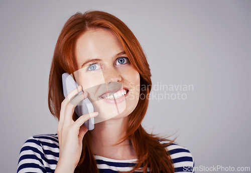 Image of Woman, phone call and network for communication in studio, internet and smile for conversation or chat. Happy female person, mockup space and voip for speaking on gray background, talking and online