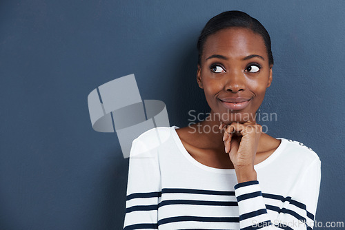 Image of Thinking, idea and black woman with mockup in studio for planning, questions or asking on blue background. Why, curious and African female model with emoji guess for problem solving or brainstorming