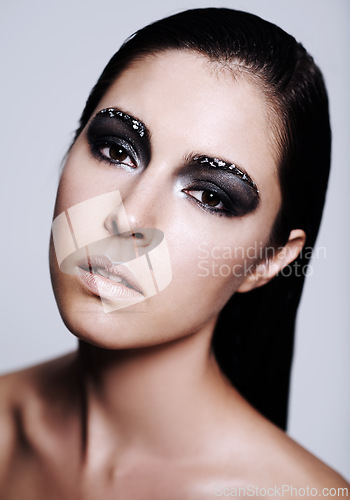 Image of Studio, portrait and woman with makeup for beauty from cosmetics for art on face of girl. Relax, model and female person with glow, shine and soft skin from skincare with treatment of dermatology