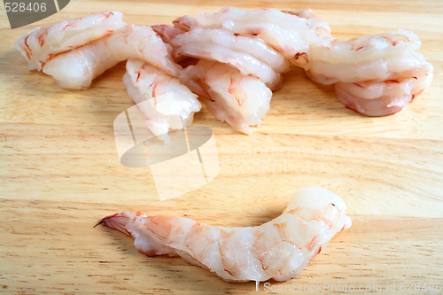Image of Raw prawns on chopping board