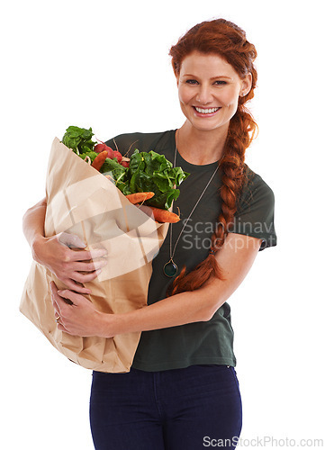 Image of Happy woman, portrait and groceries in studio for product, discount and vegetable shopping. Person, delivery offer and smile in white background for nutrition, healthy food and fruits for diet choice