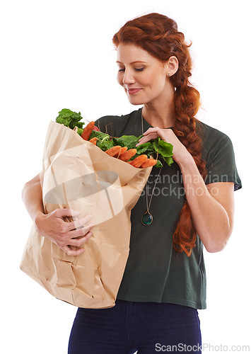 Image of Woman, grocery bag and vegetables nutrition in studio or healthy eating or food vitamins, fiber or white background. Female person carrots and wellness snack or lose weight diet, mockup space or meal