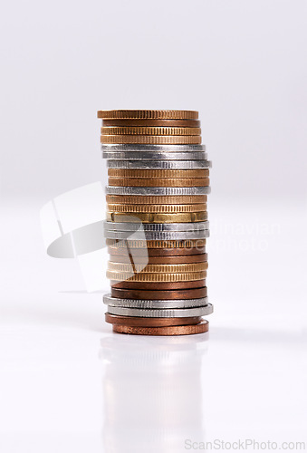 Image of Money, coins stack and change on table top for finance, investment and cash tips for budgeting progress. Savings pile, counting rands or bank balance for economic recession, earnings or banking funds