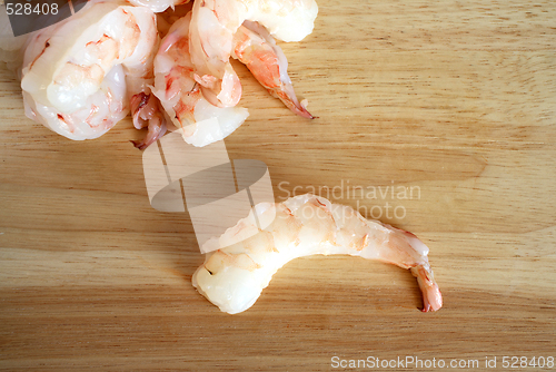 Image of Raw prawns on chopping board